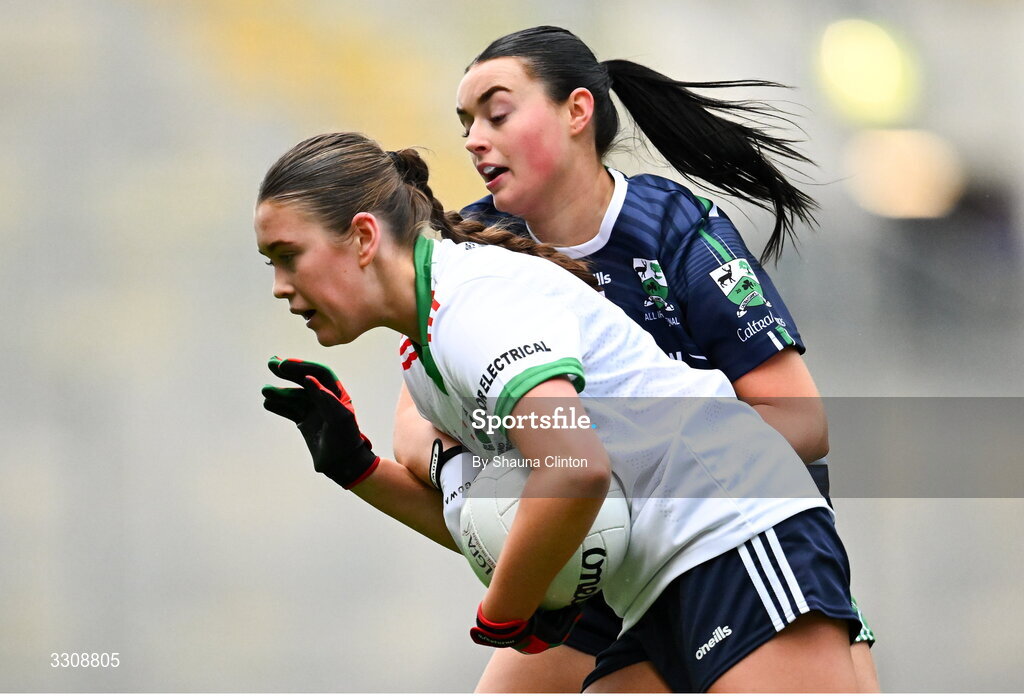 13 December 2025; Katie Mai Reilly of Knockbride is tackled by Ciara Murray of Caltra Cuans during the AIB All-Ireland Ladies Football Club Intermediate Club Championship final match between Knockbride of Cavan and Caltra Cuans of Galway at Croke Park in Dublin. Photo by Shauna Clinton/Sportsfile