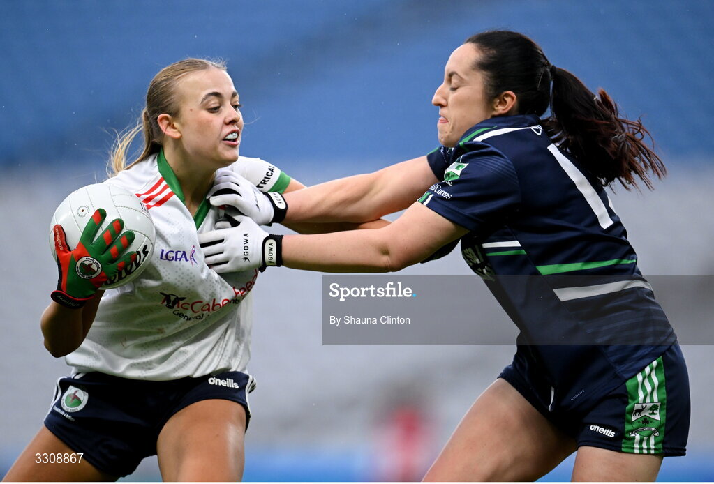 13 December 2025; Abbi Connor of Knockbride in action against Laura Naughton of Caltra Cuans during the AIB All-Ireland Ladies Football Club Intermediate Club Championship final match between Knockbride of Cavan and Caltra Cuans of Galway at Croke Park in Dublin. Photo by Shauna Clinton/Sportsfile