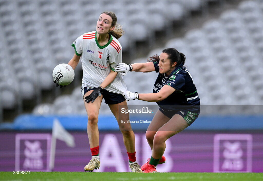 13 December 2025; Gia McCabe of Knockbride in action against Laura Naughton of Caltra Cuans during the AIB All-Ireland Ladies Football Club Intermediate Club Championship final match between Knockbride of Cavan and Caltra Cuans of Galway at Croke Park in Dublin. Photo by Shauna Clinton/Sportsfile