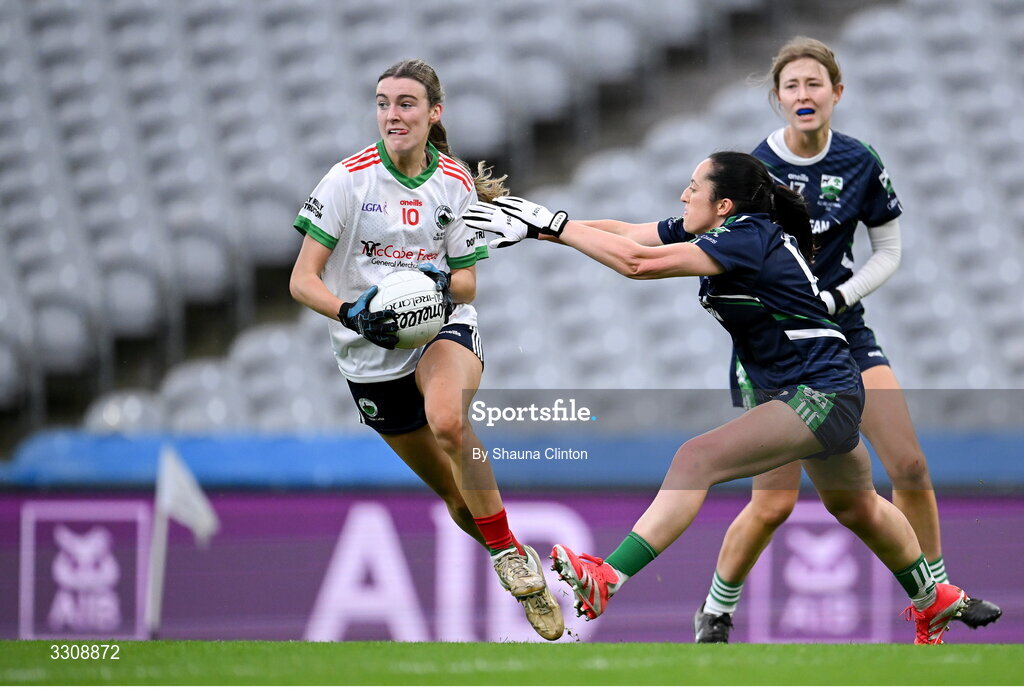 13 December 2025; Gia McCabe of Knockbride in action against Laura Naughton of Caltra Cuans during the AIB All-Ireland Ladies Football Club Intermediate Club Championship final match between Knockbride of Cavan and Caltra Cuans of Galway at Croke Park in Dublin. Photo by Shauna Clinton/Sportsfile