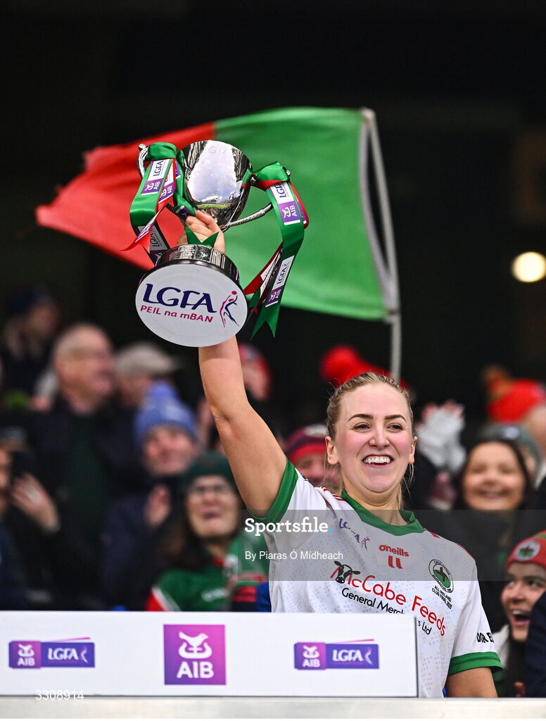 13 December 2025; Knockbride captain Sarah McCabe lifts the cup after her side's victory in the AIB All-Ireland Ladies Football Club Intermediate Club Championship final match between Knockbride of Cavan and Caltra Cuans of Galway at Croke Park in Dublin. Photo by Piaras Ó Mídheach/Sportsfile