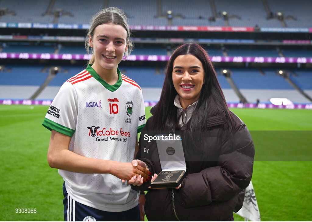 13 December 2025; Gia McCabe of Knockbride receives the Player of the Match award from Grace Cullen, representing AIB, after the AIB All-Ireland Ladies Football Club Intermediate Club Championship final match between Knockbride of Cavan and Caltra Cuans of Galway at Croke Park in Dublin. Photo by Shauna Clinton/Sportsfile