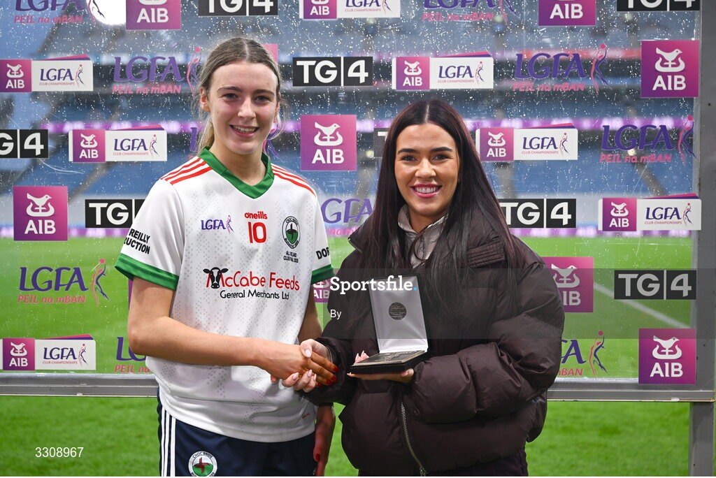 13 December 2025; Gia McCabe of Knockbride receives the Player of the Match award from Grace Cullen, representing AIB, after the AIB All-Ireland Ladies Football Club Intermediate Club Championship final match between Knockbride of Cavan and Caltra Cuans of Galway at Croke Park in Dublin. Photo by Shauna Clinton/Sportsfile