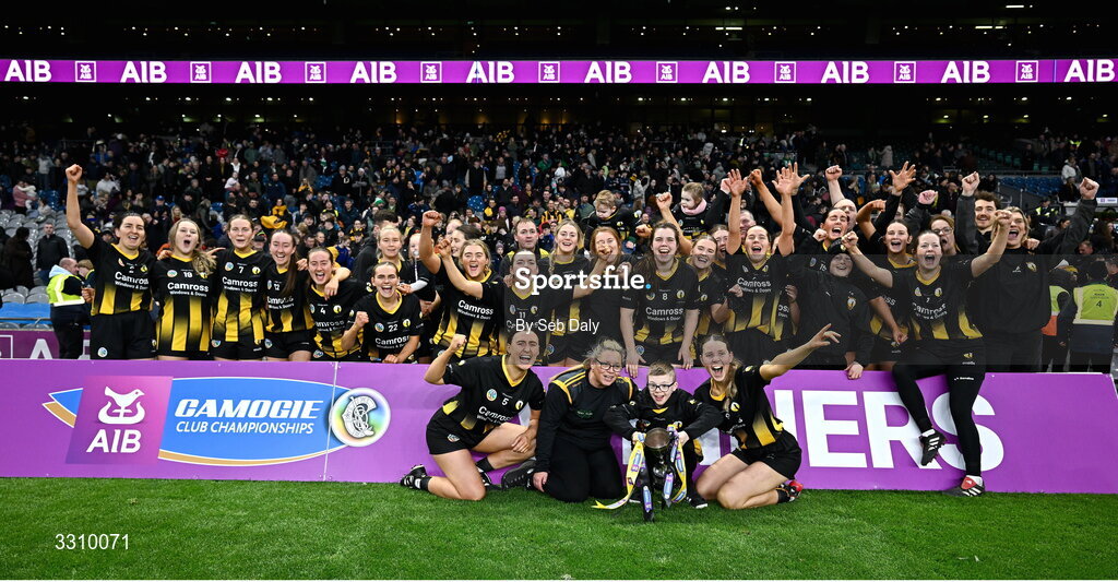 14 December 2025; Camross players and coaches celebrate with the Agnes O'Farrelly Cup after their side's victory in the AIB All-Ireland Camogie Intermediate Club Championship final match between Ballincollig of Cork and Camross of Laois at Croke Park in Dublin. Photo by Seb Daly/Sportsfile