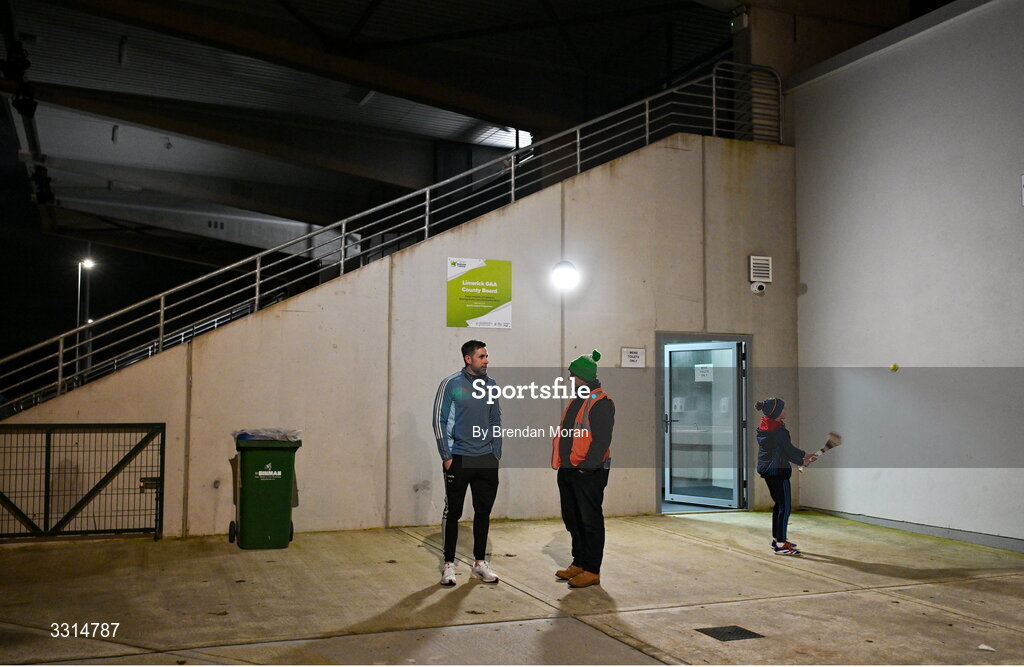 2 January 2026; Tipperary manager Niall Fitzgerald, left, in coversation with event steward Hammy Dawson, from St Patrick's GAA club, Limerick, as his son Danny Fitzgerald, age 9, keeps himself entertained before the McGrath Cup match between Limerick and Tipperary at Mick Neville Park in Rathkeale, Limerick. Photo by Brendan Moran/Sportsfile