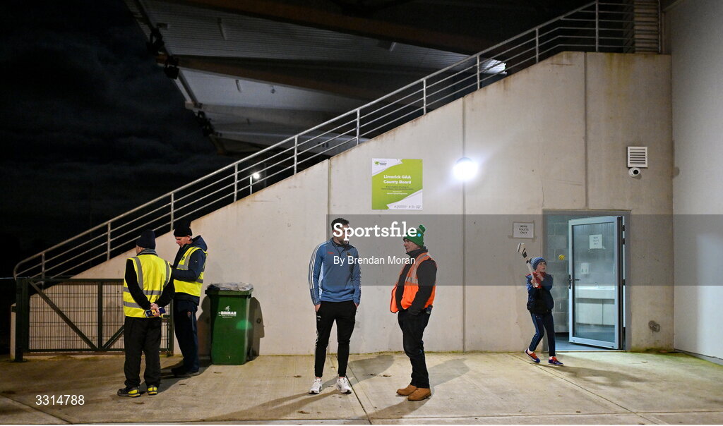 2 January 2026; Tipperary manager Niall Fitzgerald, third from left, in coversation with event steward Hammy Dawson, from St Patrick's GAA club, Limerick, as his son Danny Fitzgerald, age 9, keeps himself entertained before the McGrath Cup match between Limerick and Tipperary at Mick Neville Park in Rathkeale, Limerick. Photo by Brendan Moran/Sportsfile