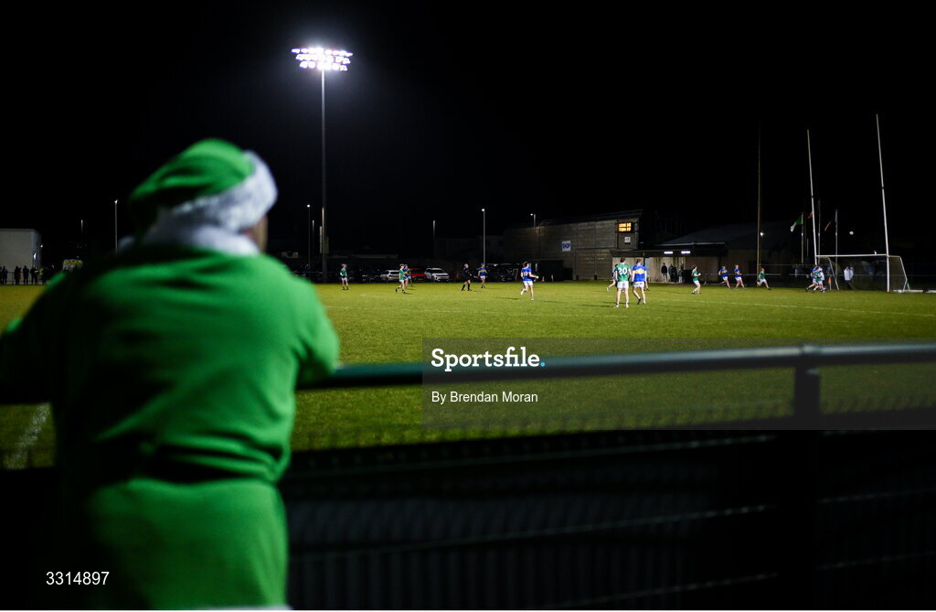 2 January 2026; A general view of the action as Limerick supporter Pat Carroll, from Croom in Limerick, wearing a green Santa Claus outfit to keep warm, looks on during the McGrath Cup match between Limerick and Tipperary at Mick Neville Park in Rathkeale, Limerick. Photo by Brendan Moran/Sportsfile