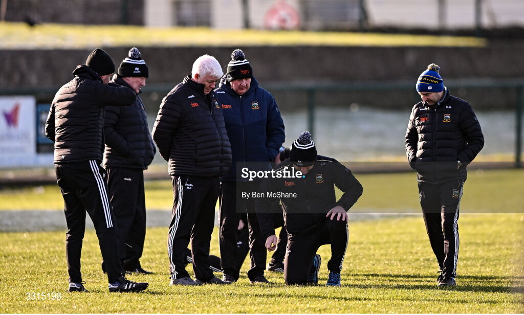 3 January 2026; Tipperary manager Liam Cahill inspects the pitch hardness alongside his backroom staff before the Co-Op Superstores Munster Senior Hurling League match between Tipperary and Waterford at Clonmel Sportsfield in Clonmel, Tipperary. Photo by Ben McShane/Sportsfile