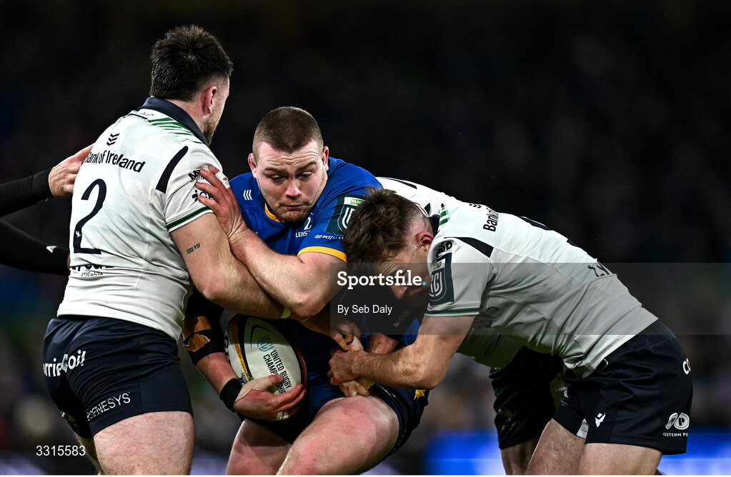 3 January 2026; Jack Boyle of Leinster is tackled by Connacht players, from left, Dylan Tierney-Martin, Matthew Devine and Joe Joyce during the United Rugby Championship match between Leinster and Connacht at the Aviva Stadium in Dublin. Photo by Seb Daly/Sportsfile