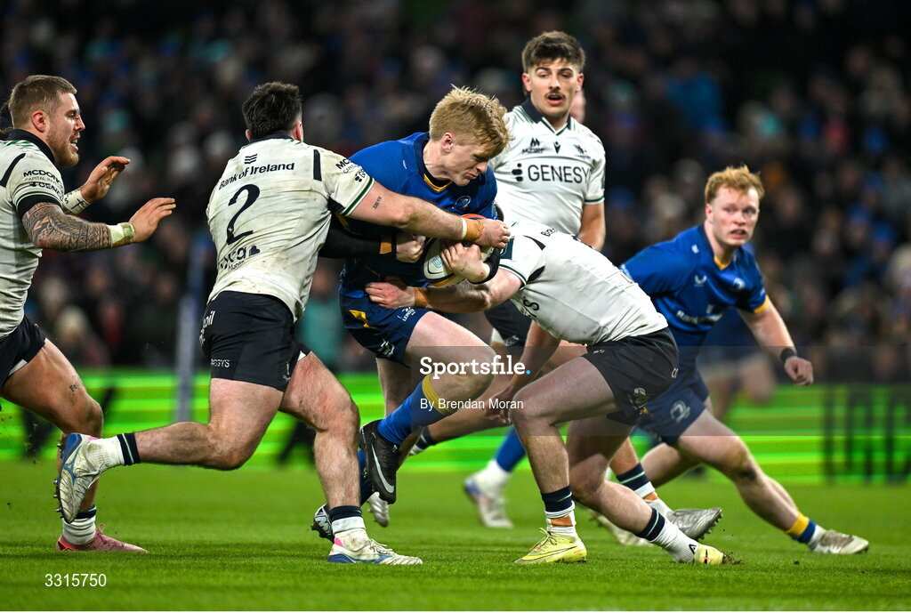 3 January 2026; Tommy O'Brien of Leinster on his way to scoring his side's fifth try despite the tackles of Dylan Tierney-Martin, left, and Finn Treacy of Connacht during the United Rugby Championship match between Leinster and Connacht at Aviva Stadium in Dublin. Photo by Brendan Moran/Sportsfile