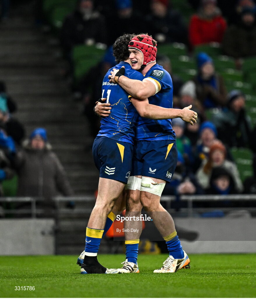 3 January 2026; Joshua Kenny, left, is congratulated by Leinster team-mate Josh van der Flier, right, after scoring their side's eight try during the United Rugby Championship match between Leinster and Connacht at the Aviva Stadium in Dublin. Photo by Seb Daly/Sportsfile