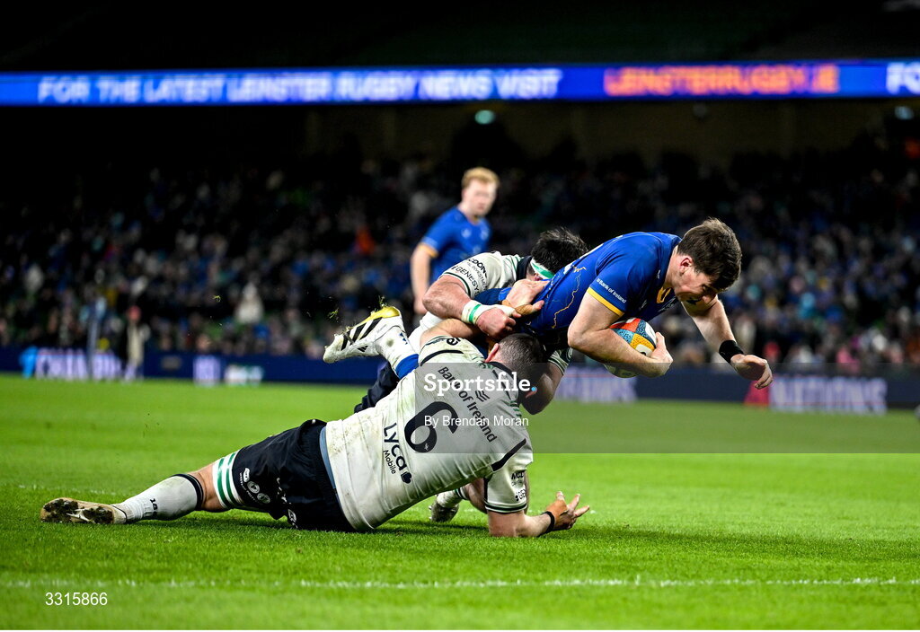 3 January 2026; Charlie Tector of Leinster is tackled by Josh Murphy, 6, and Denis Buckley of Connacht during the United Rugby Championship match between Leinster and Connacht at Aviva Stadium in Dublin. Photo by Brendan Moran/Sportsfile