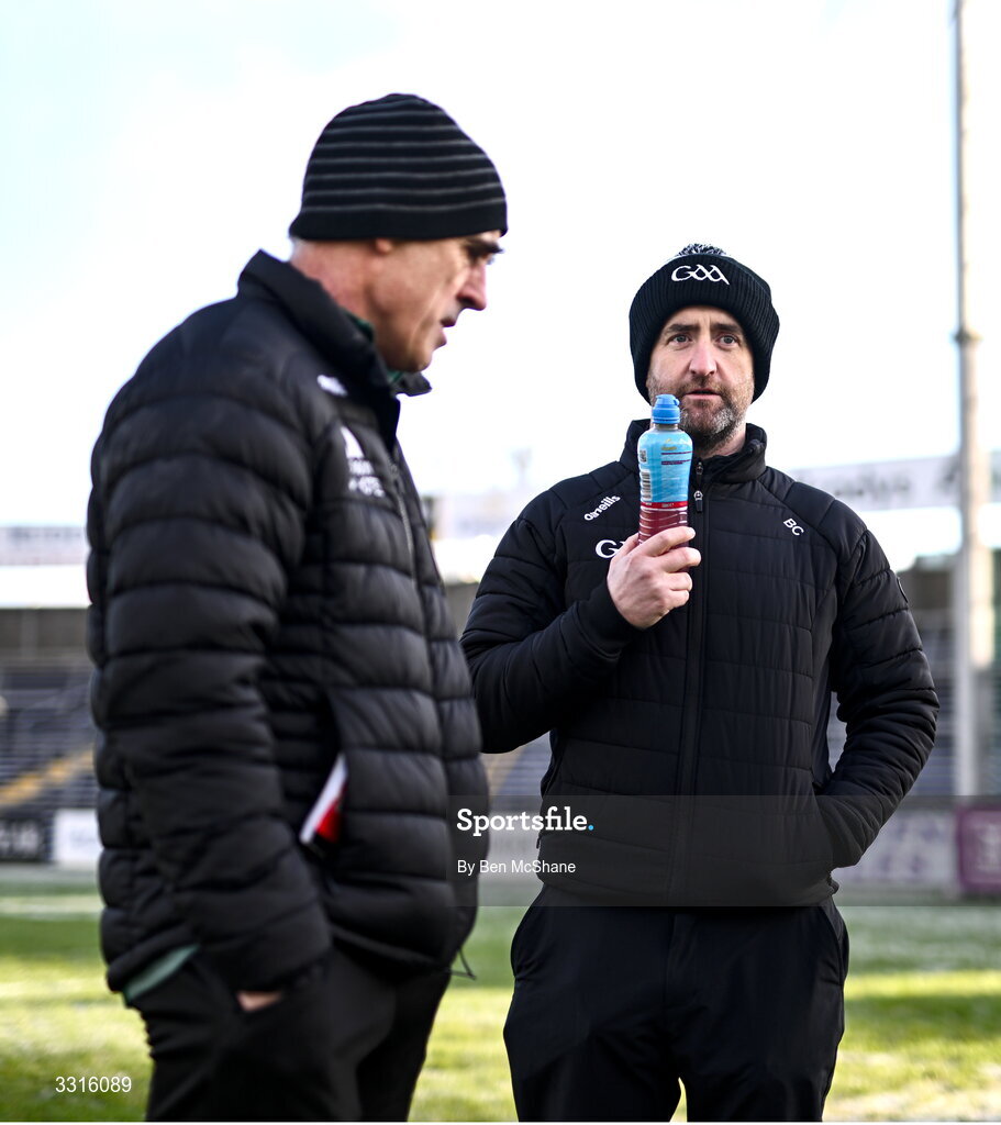 4 January 2026; Referee Brendan Cawley, right, in conversation with St Brigid's manager Anthony Cunningham before the AIB GAA Football All-Ireland Senior Club Championship semi-final match between between St Brigid's of Roscommon and Scotstown of Monaghan at Kingspan Breffni in Cavan. Photo by Ben McShane/Sportsfile