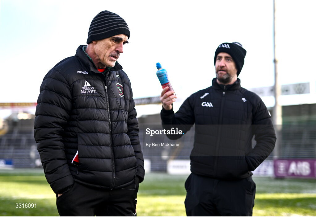 4 January 2026; Referee Brendan Cawley, right, in conversation with St Brigid's manager Anthony Cunningham before the AIB GAA Football All-Ireland Senior Club Championship semi-final match between between St Brigid's of Roscommon and Scotstown of Monaghan at Kingspan Breffni in Cavan. Photo by Ben McShane/Sportsfile