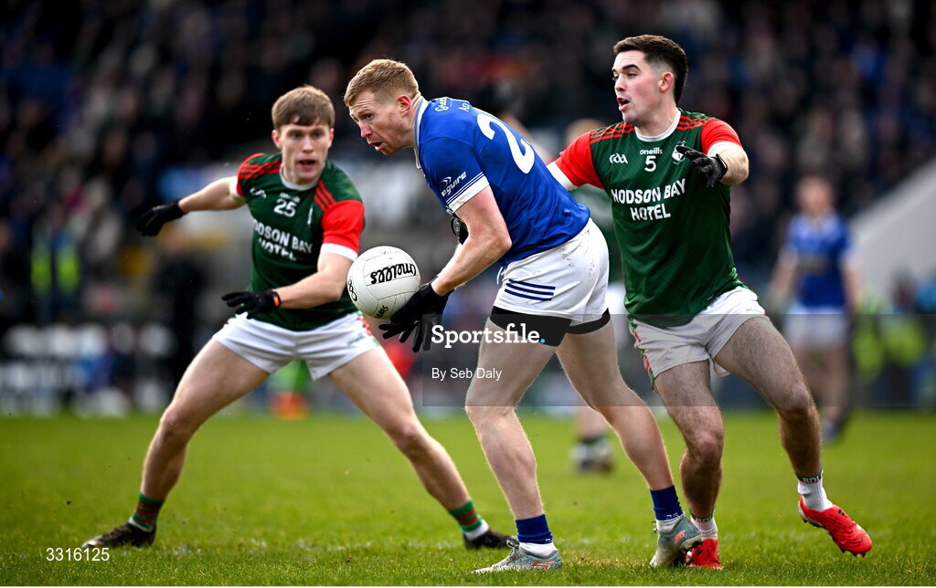 4 January 2026; Kieran Hughes of Scotstown in action against St Brigid's players Pearse Frost, left, and Ruaidhrí Fallon during the AIB GAA Football All-Ireland Senior Club Championship semi-final match between between St Brigid's of Roscommon and Scotstown of Monaghan at Kingspan Breffni in Cavan. Photo by Seb Daly/Sportsfile