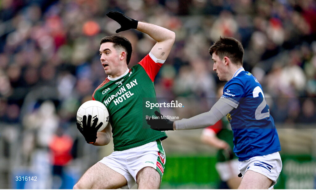 4 January 2026; Ruaidhrí Fallon of St Brigid's is tackled by Nicky Sherlock of Scotstown during the AIB GAA Football All-Ireland Senior Club Championship semi-final match between between St Brigid's of Roscommon and Scotstown of Monaghan at Kingspan Breffni in Cavan. Photo by Ben McShane/Sportsfile