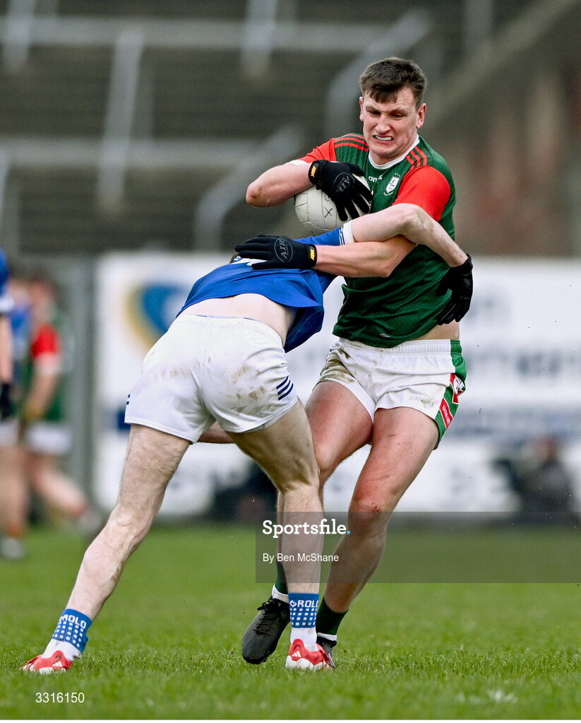 4 January 2026; Shane Cunnane of St Brigid's is tackled by Mícheál McCarville of Scotstown during the AIB GAA Football All-Ireland Senior Club Championship semi-final match between between St Brigid's of Roscommon and Scotstown of Monaghan at Kingspan Breffni in Cavan. Photo by Ben McShane/Sportsfile