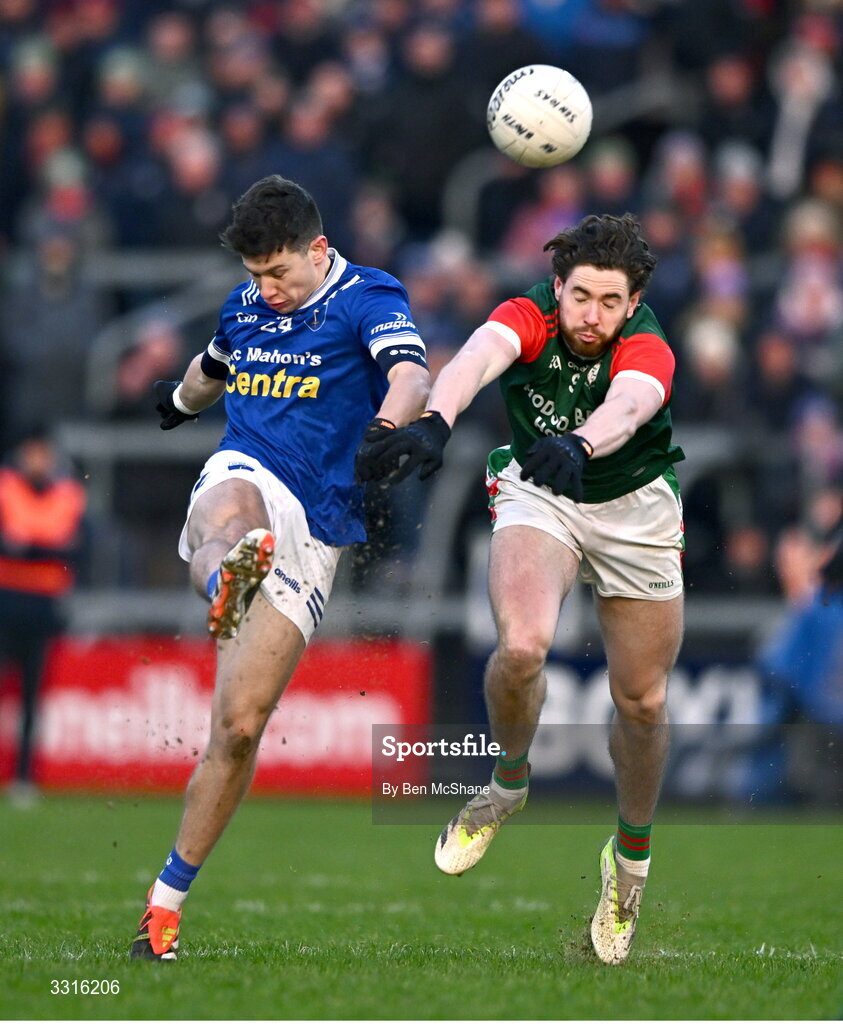 4 January 2026; Francis Maguire of Scotstown kicks a point despite the attention of Eddie Nolan of St Brigid's during the AIB GAA Football All-Ireland Senior Club Championship semi-final match between between St Brigid's of Roscommon and Scotstown of Monaghan at Kingspan Breffni in Cavan. Photo by Ben McShane/Sportsfile
