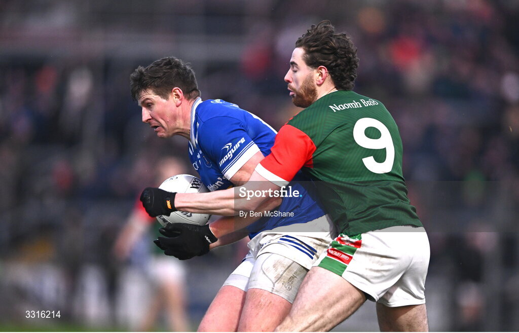 4 January 2026; Darren Hughes of Scotstown is tackled by Eddie Nolan of St Brigid's during the AIB GAA Football All-Ireland Senior Club Championship semi-final match between between St Brigid's of Roscommon and Scotstown of Monaghan at Kingspan Breffni in Cavan. Photo by Ben McShane/Sportsfile