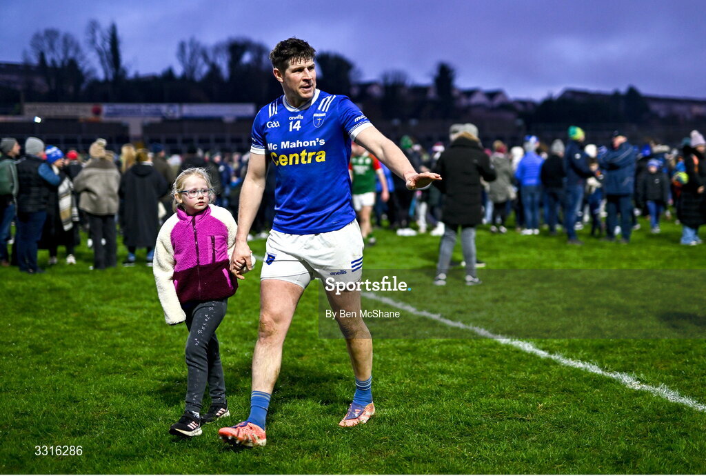 4 January 2026; Darren Hughes of Scotstown leaves the pitch hand-in-hand with his daughter Ava after his side's defeat in the AIB GAA Football All-Ireland Senior Club Championship semi-final match between between St Brigid's of Roscommon and Scotstown of Monaghan at Kingspan Breffni in Cavan. Photo by Ben McShane/Sportsfile
