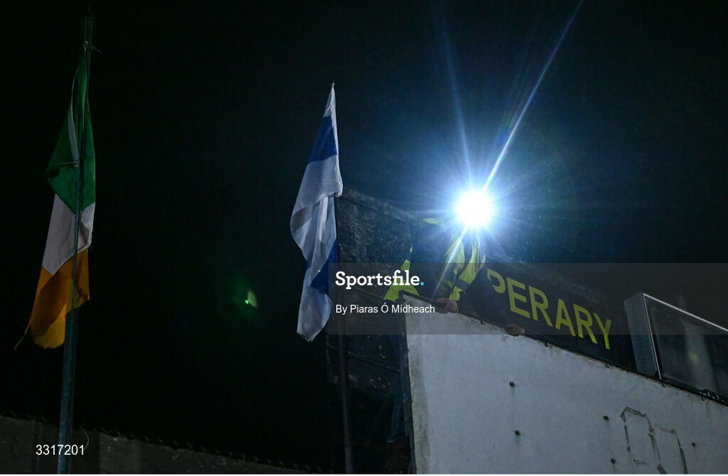 6 January 2026; Groundsman Joe Carmody, wearing a headlamp, looks out from the scoreboard position before the Cappawhite GAA club flag before the McGrath Cup match between Tipperary and Cork at Cappawhite GAA Club in Tipperary. Photo by Piaras Ó Mídheach/Sportsfile