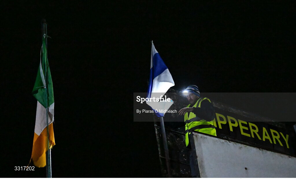 6 January 2026; Groundsman Joe Carmody puts up the Cappawhite GAA club flag before the McGrath Cup match between Tipperary and Cork at Cappawhite GAA Club in Tipperary. Photo by Piaras Ó Mídheach/Sportsfile