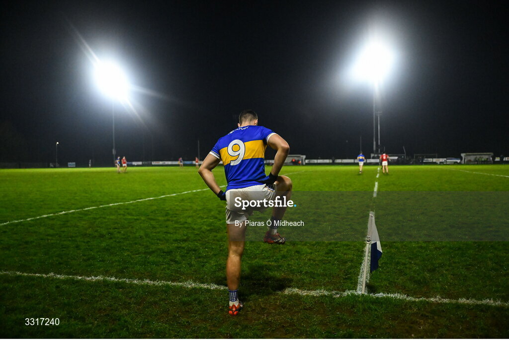 6 January 2026; Tipperary midfielder Kieran Costello takes a stretch as he prepares for the second half to start in the McGrath Cup match between Tipperary and Cork at Cappawhite GAA Club in Tipperary. Photo by Piaras Ó Mídheach/Sportsfile
