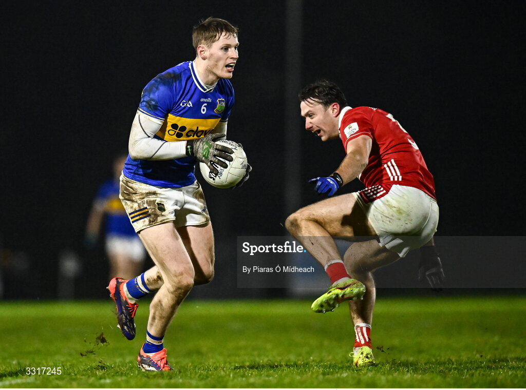 6 January 2026; Paudie Feehan of Tipperary in action against Seán Meehan of Cork during the McGrath Cup match between Tipperary and Cork at Cappawhite GAA Club in Tipperary. Photo by Piaras Ó Mídheach/Sportsfile