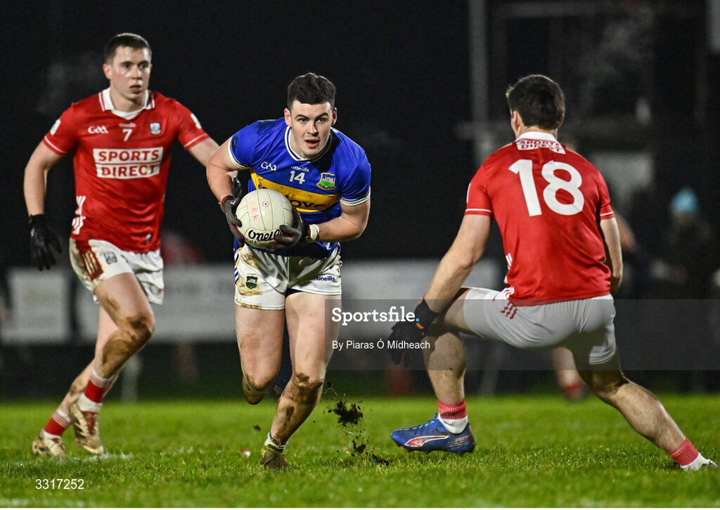6 January 2026; Seán O'Connor of Tipperary in action against Luke Fahy, 7, and Colm O'Shea of Cork during the McGrath Cup match between Tipperary and Cork at Cappawhite GAA Club in Tipperary. Photo by Piaras Ó Mídheach/Sportsfile