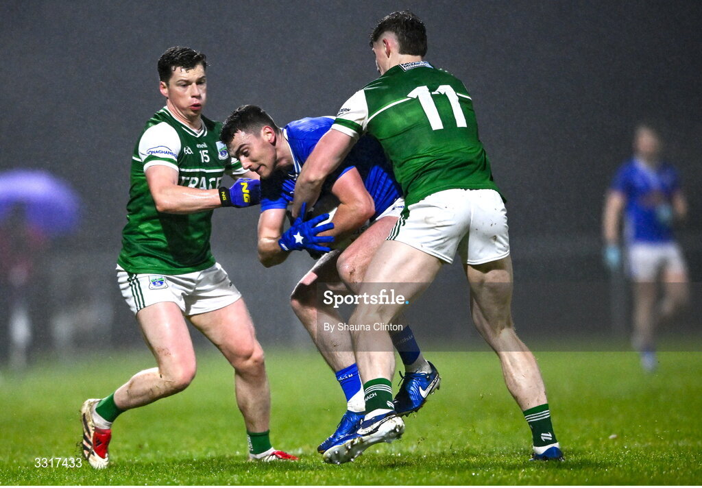 7 January 2026; Peter Corrigan of Cavan is tackled by Fermanagh players Gary McKenna, left, and Darragh McGurn during the Bank of Ireland Dr McKenna Cup match between Fermanagh and Cavan at St Patrick's Park in Tempo, Fermanagh. Photo by Shauna Clinton/Sportsfile