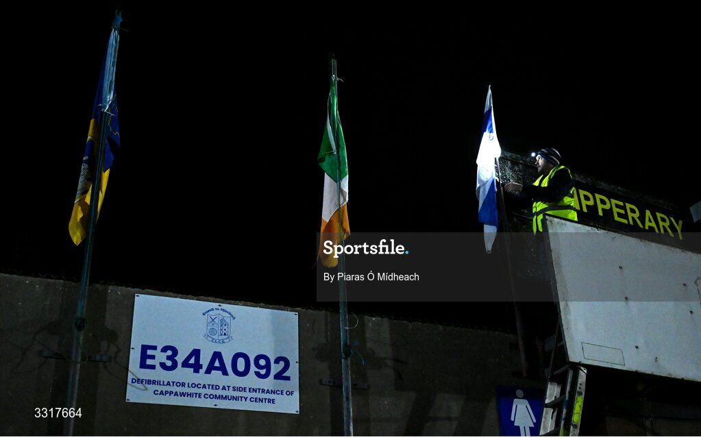 6 January 2026; Groundsman Joe Carmody puts up the Cappawhite GAA club flag before the McGrath Cup match between Tipperary and Cork at Cappawhite GAA Club in Tipperary. Photo by Piaras Ó Mídheach/Sportsfile