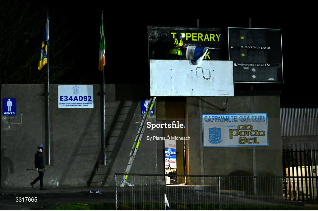 6 January 2026; Groundsman Joe Carmody puts up the Cappawhite GAA club flag before the McGrath Cup match between Tipperary and Cork at Cappawhite GAA Club in Tipperary. Photo by Piaras Ó Mídheach/Sportsfile