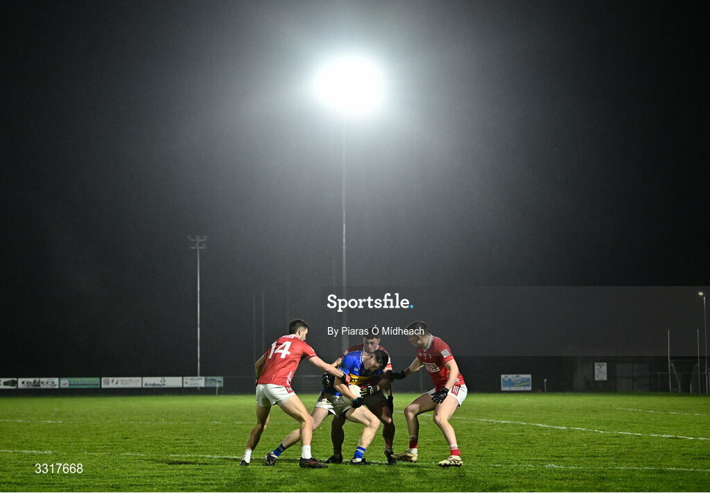 6 January 2026; Eoin O'Connell of Tipperary in action against Cork players Chris Óg Jones, Mark Cronin and Luke Fahy during the McGrath Cup match between Tipperary and Cork at Cappawhite GAA Club in Tipperary. Photo by Piaras Ó Mídheach/Sportsfile