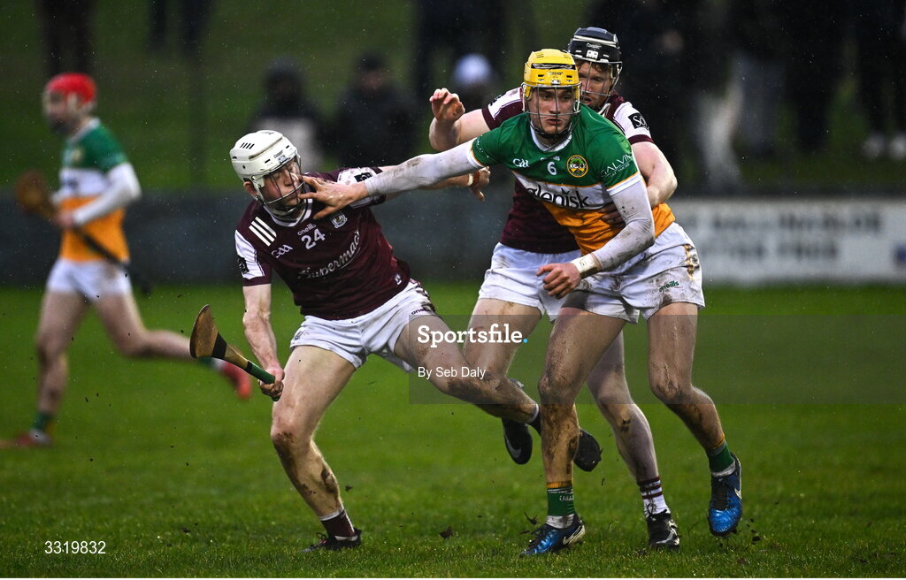 11 January 2026; Donal Shirley of Offaly in action against Galway players John Fleming, left, and Michael Power during the Dioralyte Walsh Cup semi-final match between Galway and Offaly at Duggan Park in Ballinasloe, Galway. Photo by Seb Daly/Sportsfile