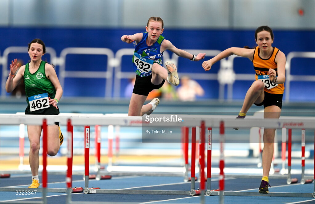 18 January 2026; Hannah Redican of Tralee Harriers A.C., Kerry, centre, competes in the girls u15 60m hurdles during day two of the 123.ie National Indoor AAI Games and Combined Events at the National Indoor Arena on the Sport Ireland Campus in Dublin.  Photo by Tyler Miller/Sportsfile