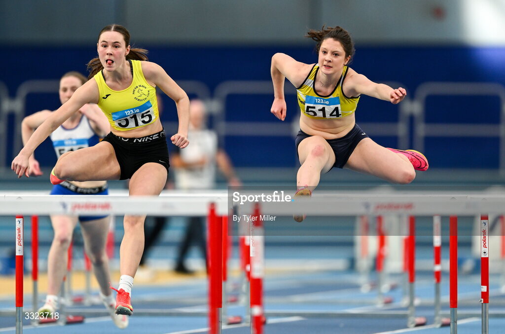 18 January 2026; Emily Hession of South Sligo A.C., Sligo, left, and Aoife Callan of Bandon A.C., Cork, compete in the women's u20 60m hurdles during day two of the 123.ie National Indoor AAI Games and Combined Events at the National Indoor Arena on the Sport Ireland Campus in Dublin.  Photo by Tyler Miller/Sportsfile