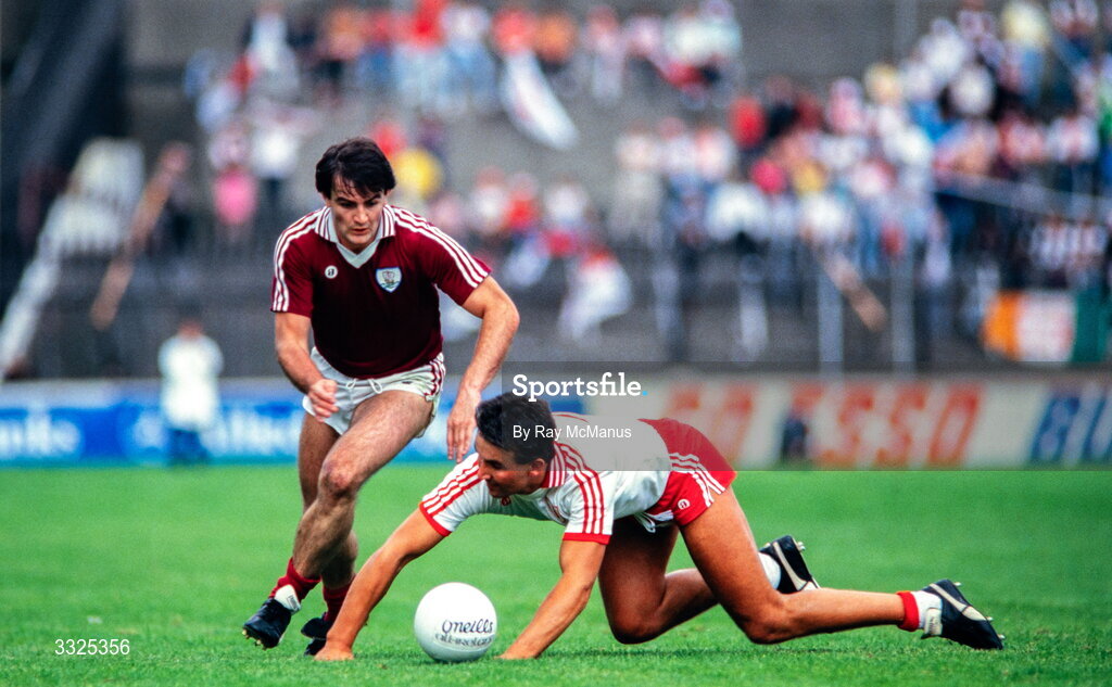 17 August 1986; Ciaran McGarvey of Tyrone falls on the ball next to Brian O'Donnell of Galway during the All-Ireland Senior Football Championship Semi-Final match between Tyrone and Galway at Croke Park in Dublin. Photo by Ray McManus/Sportsfile