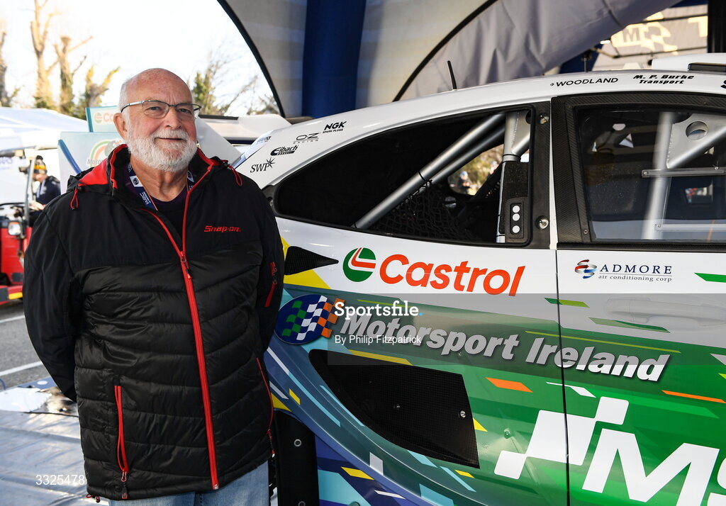 21 January 2026; Motorsport Ireland Rally Academy founder and patron John Coyne poses next to the Ford Puma Rally1 of Joshua McErlean and Eoin Treacy of Ireland during day one of the FIA World Rally Championship Round One in Monte Carlo, France. Photo by Philip Fitzpatrick/Sportsfile