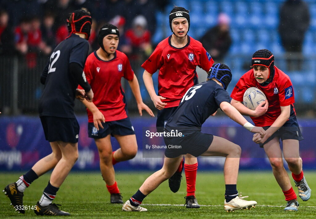 22 January 2026; Robert Creane Bolster of CUS is tackled by Luke Hamilton of Wesley College during the Bank of Ireland Leinster Rugby Boys Schools Fr Godfrey Cup semi-final match between Wesley College and CUS at Energia Park in Dublin. Photo by Shauna Clinton/Sportsfile