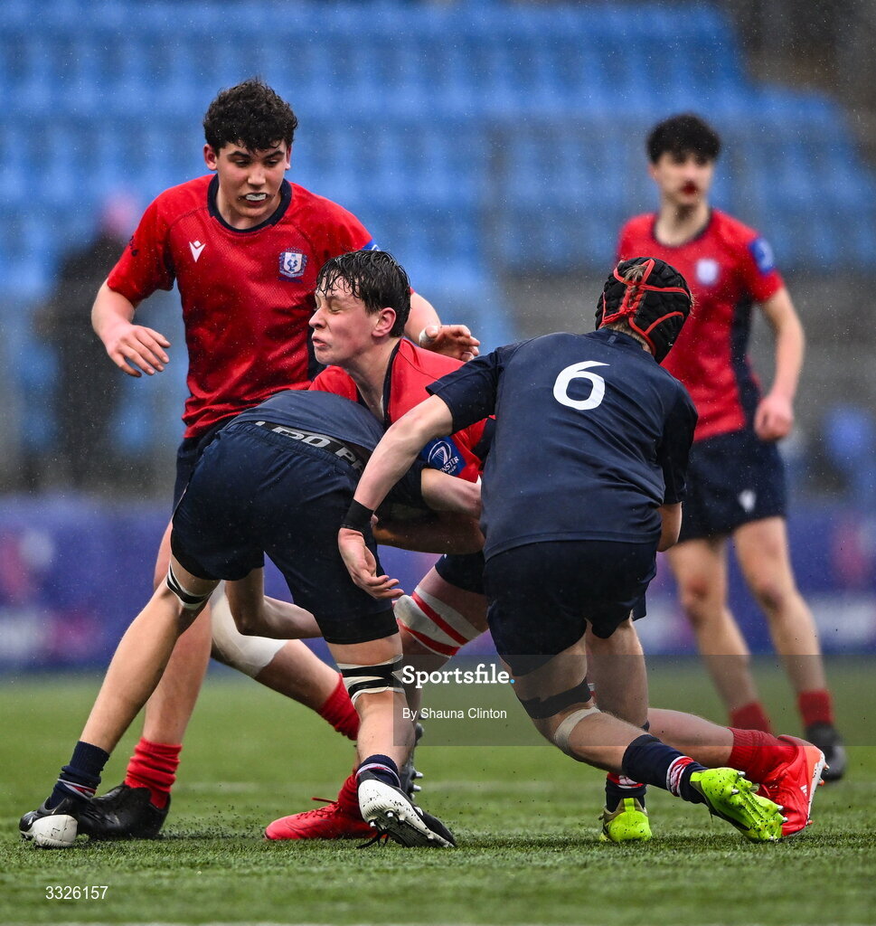 22 January 2026; Ruairí O'Gorman of CUS is tackled by Jacob Hanna of Wesley College during the Bank of Ireland Leinster Rugby Boys Schools Fr Godfrey Cup semi-final match between Wesley College and CUS at Energia Park in Dublin. Photo by Shauna Clinton/Sportsfile