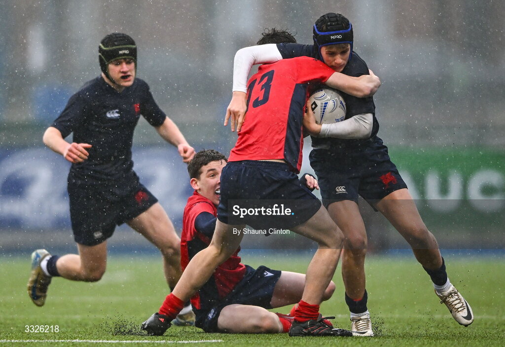 22 January 2026; Luke Hamilton of Wesley College is tackled by Leonard Deering of CUS during the Bank of Ireland Leinster Rugby Boys Schools Fr Godfrey Cup semi-final match between Wesley College and CUS at Energia Park in Dublin. Photo by Shauna Clinton/Sportsfile