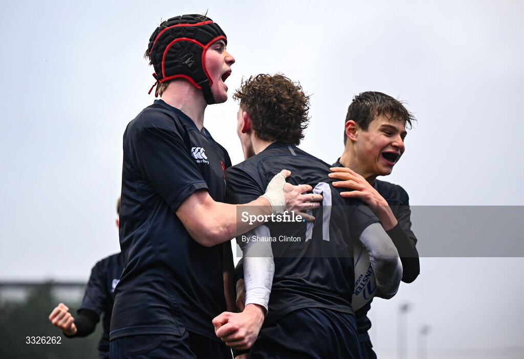 22 January 2026; Harry Greene of Wesly College, centre, celebrates  with team-mates after scoring his side's third try during the Bank of Ireland Leinster Rugby Boys Schools Fr Godfrey Cup semi-final match between Wesley College and CUS at Energia Park in Dublin. Photo by Shauna Clinton/Sportsfile