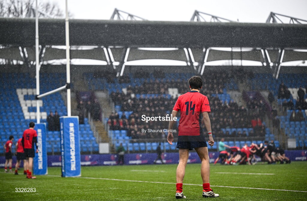 22 January 2026; Eli Vukovic of CUS, 14, looks on as players from both teams engage in a scrum during the Bank of Ireland Leinster Rugby Boys Schools Fr Godfrey Cup semi-final match between Wesley College and CUS at Energia Park in Dublin. Photo by Shauna Clinton/Sportsfile