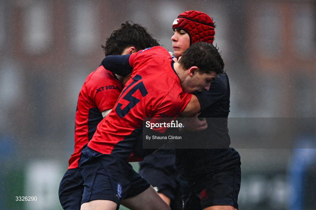22 January 2026; Graeme Wildish of Wesley College is tackled by Dan Wheatley of CUS during the Bank of Ireland Leinster Rugby Boys Schools Fr Godfrey Cup semi-final match between Wesley College and CUS at Energia Park in Dublin. Photo by Shauna Clinton/Sportsfile