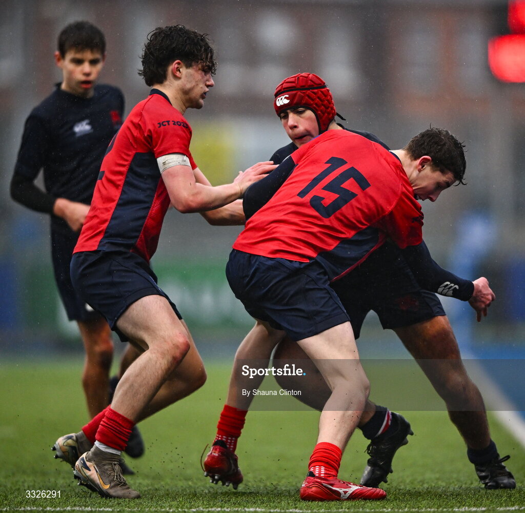 22 January 2026; Graeme Wildish of Wesley College is tackled by Dan Wheatley of CUS during the Bank of Ireland Leinster Rugby Boys Schools Fr Godfrey Cup semi-final match between Wesley College and CUS at Energia Park in Dublin. Photo by Shauna Clinton/Sportsfile