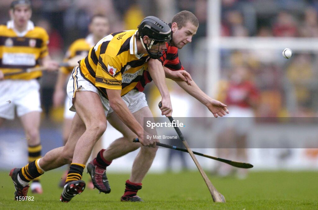 31 October 2004; Setanta O hAilpin, Na Pairsaigh, in action against Donan O'Sullivan, Cloyne. Cork County Senior Hurling Final, Na Piarsaigh v Cloyne, Pairc Ui Chaoimh, Cork. Picture credit; Matt Browne / SPORTSFILE