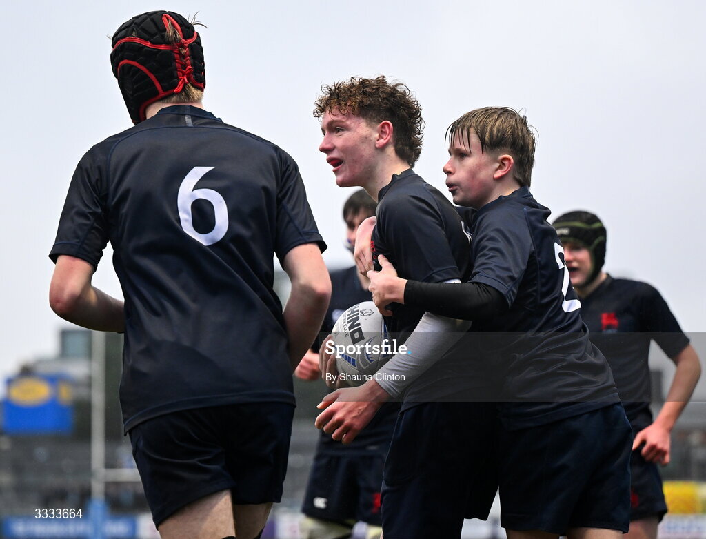 22 January 2026; Harry Greene of Wesly College, centre, is congratulated by team-mates after scoring his side's third try during the Bank of Ireland Leinster Rugby Boys Schools Fr Godfrey Cup semi-final match between Wesley College and CUS at Energia Park in Dublin. Photo by Shauna Clinton/Sportsfile