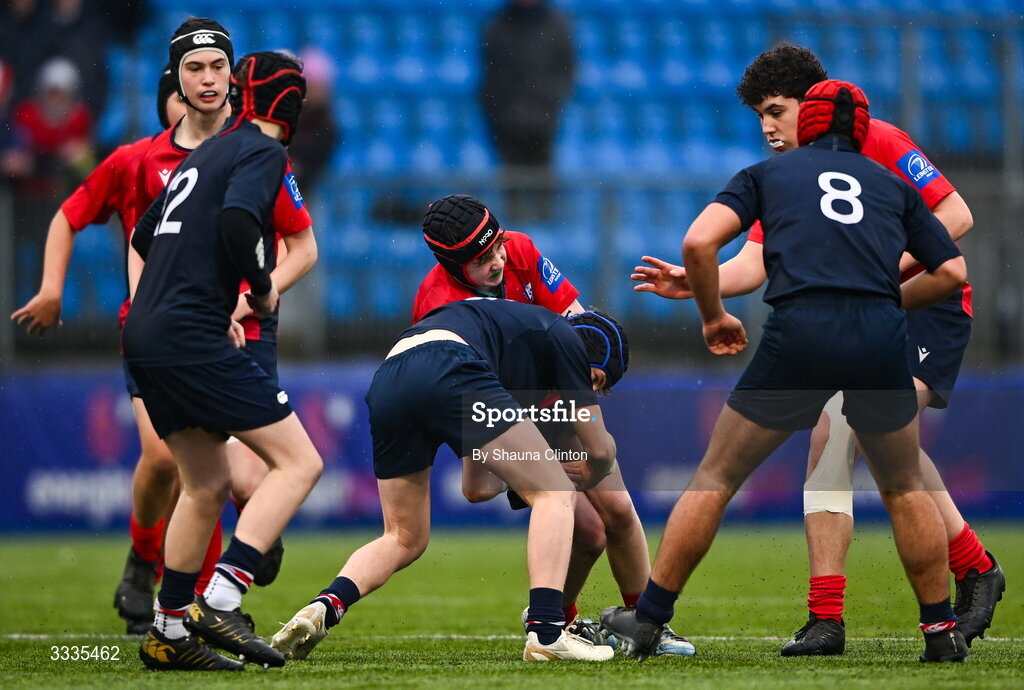 22 January 2026; Jude Murphy of CUS is tackled by Harry Popplewell of Wesley College during the Bank of Ireland Leinster Rugby Boys Schools Fr Godfrey Cup semi-final match between Wesley College and CUS at Energia Park in Dublin. Photo by Shauna Clinton/Sportsfile