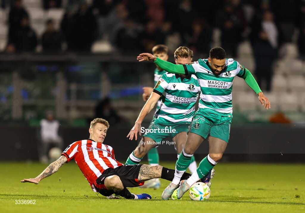 31 January 2026; Jake Mulraney of Shamrock Rovers is tackled by James McClean of Derry City during the 2026 Men's President's Cup final match between Shamrock Rovers and Derry City at Tallaght Stadium in Dublin. Photo by Michael P Ryan/Sportsfile