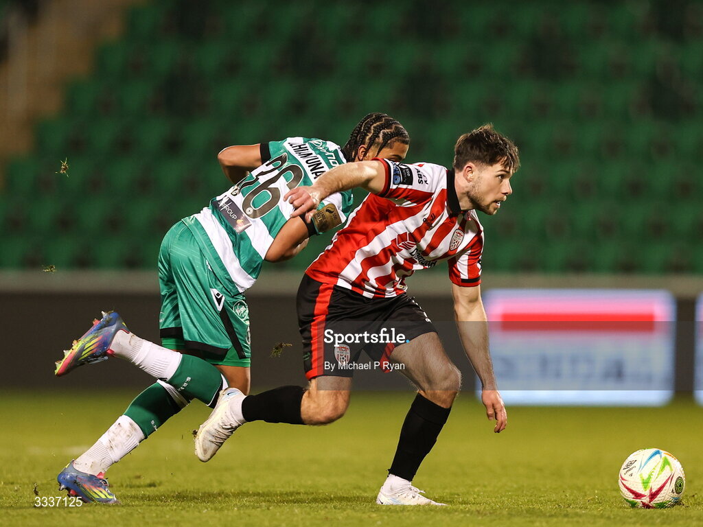 31 January 2026; Adam O'Reilly of Derry City in action against Victor Ozhianvuna of Shamrock Rovers during the 2026 Men's President's Cup final match between Shamrock Rovers and Derry City at Tallaght Stadium in Dublin. Photo by Michael P Ryan/Sportsfile